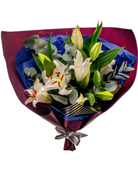 bouquet of lilies with greenery